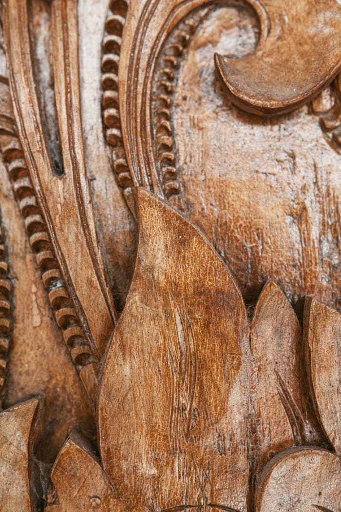 Detailed close-up of a hand-carved wooden pattern showcasing intricate artistic craftsmanship.